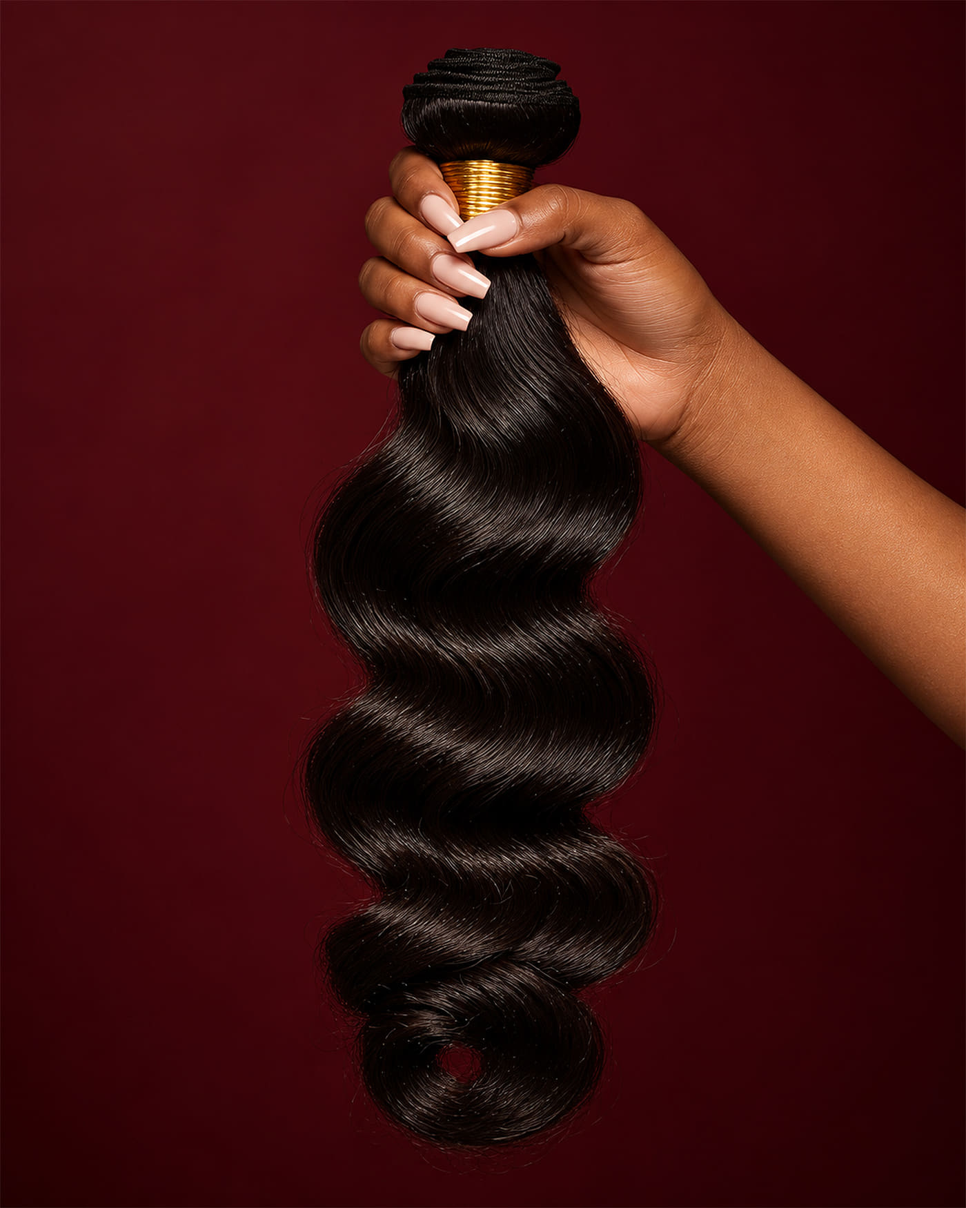 A single Timeless bundle in Body Wave held up against burgundy