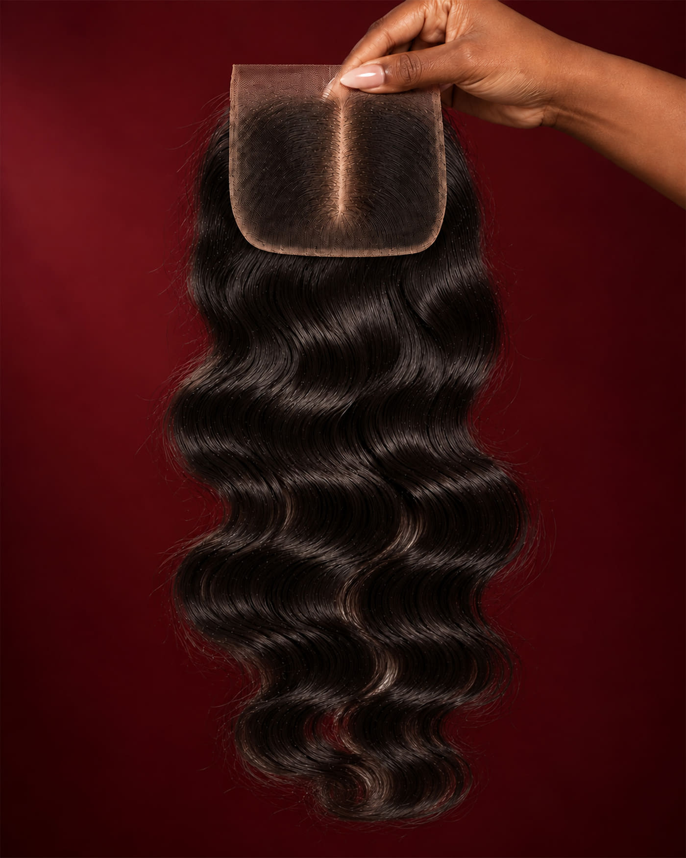 Timeless HD lace closure in Body Wave, full length held up against burgundy